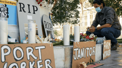 Image of worker at memorial alter